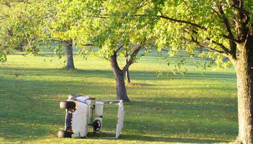 Golf cart flipped on its side