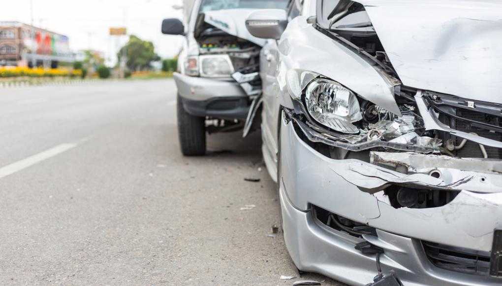 Grey truck that has rear ended a grey sedan