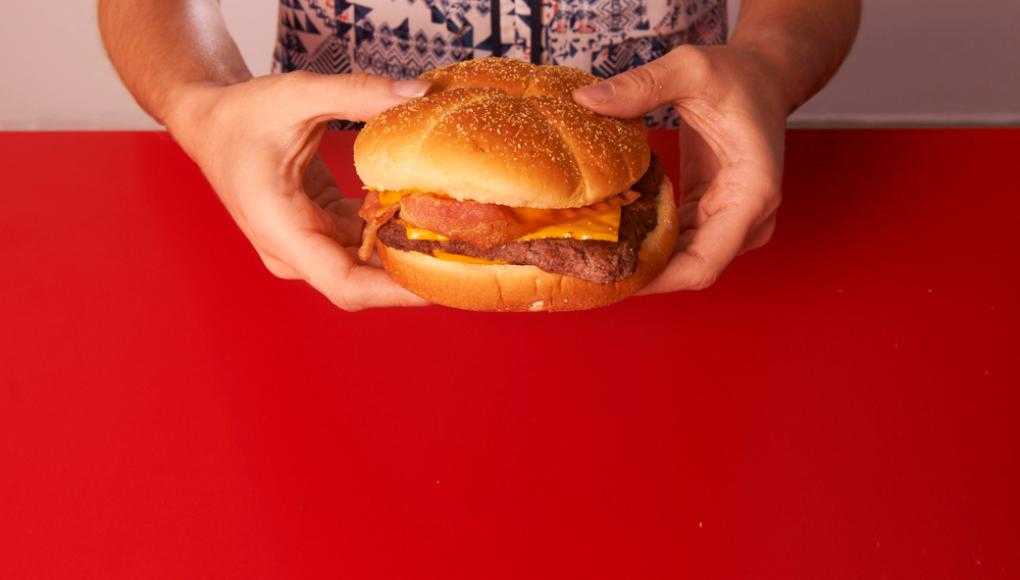 Woman holding a burger