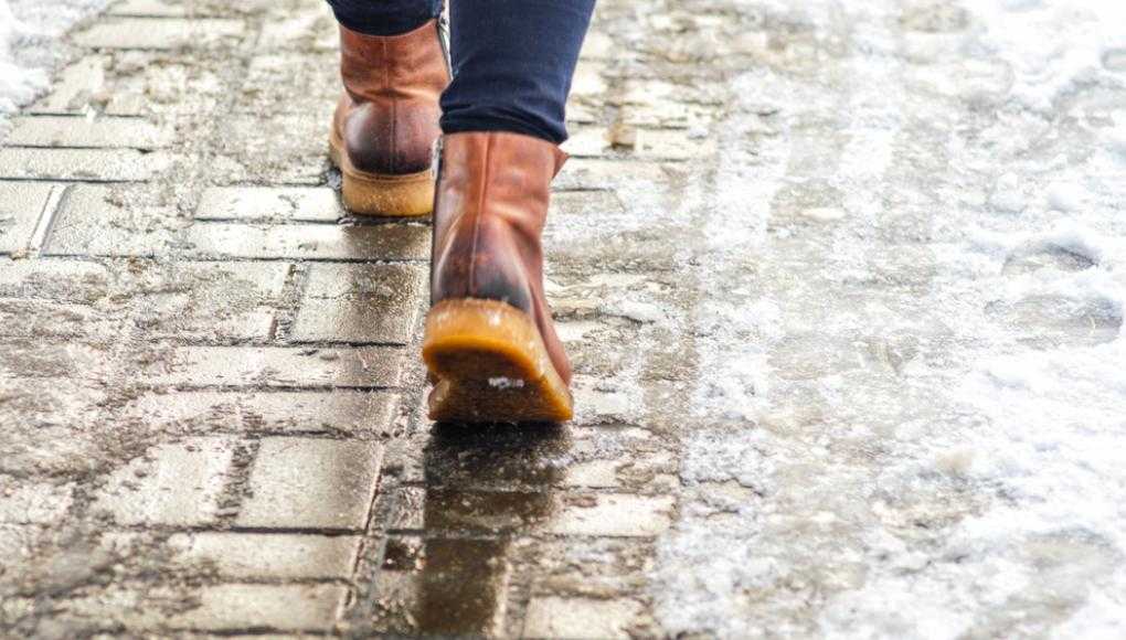 Someone walking on an icy sidewalk