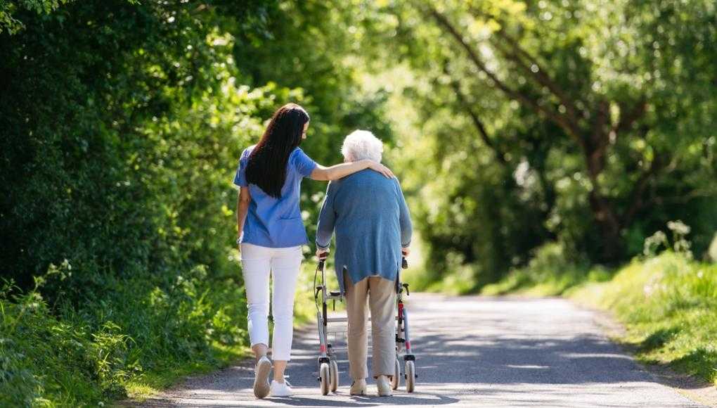 eldery woman with nursing home caretaker