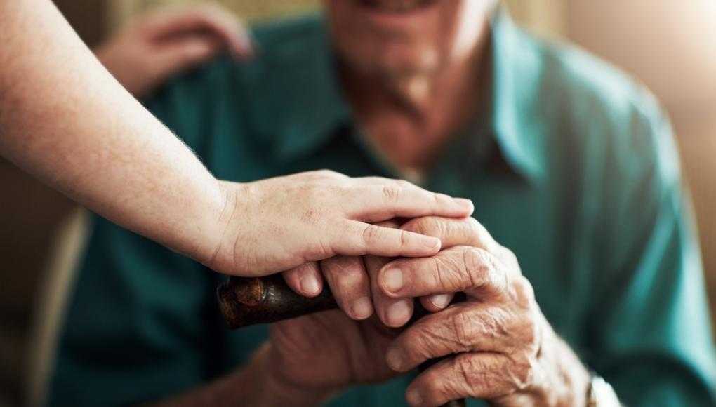 elderly man with a caregiver