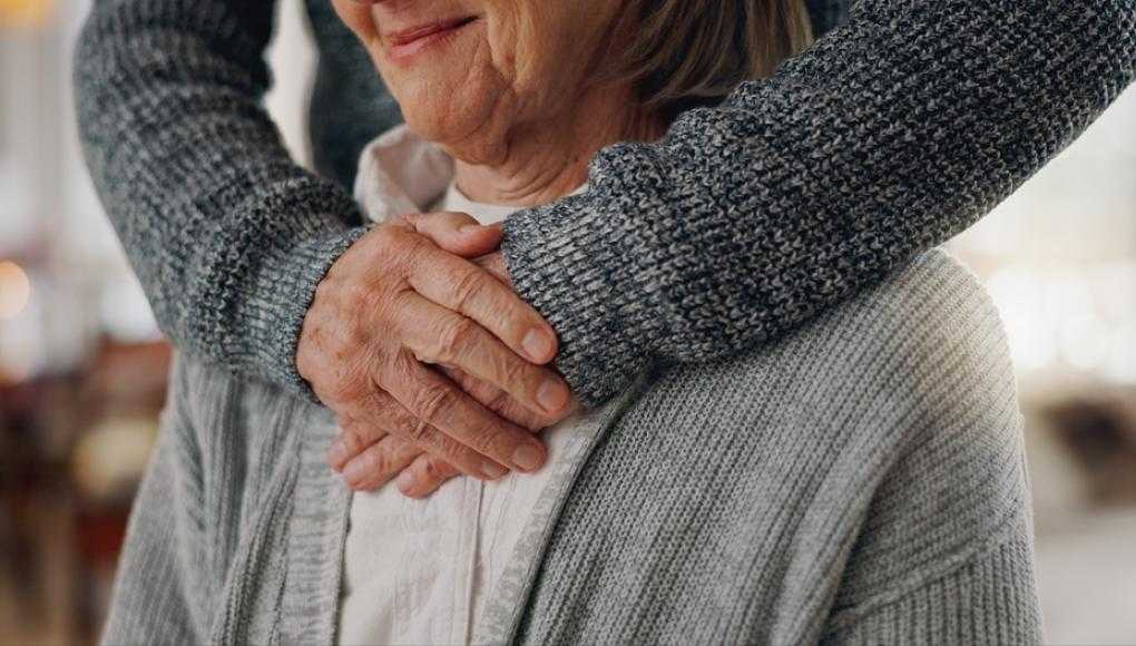 elderly woman with caretaker