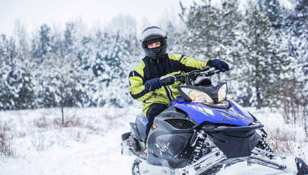 Man riding a snowmobile