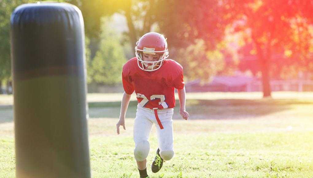 Kid playing football