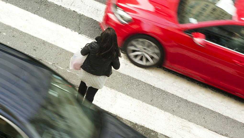 Pedestrian Fatalities Are Up in Georgia: Why Is it Difficult to Cross the Street? - A woman crossing the pedestrian lane