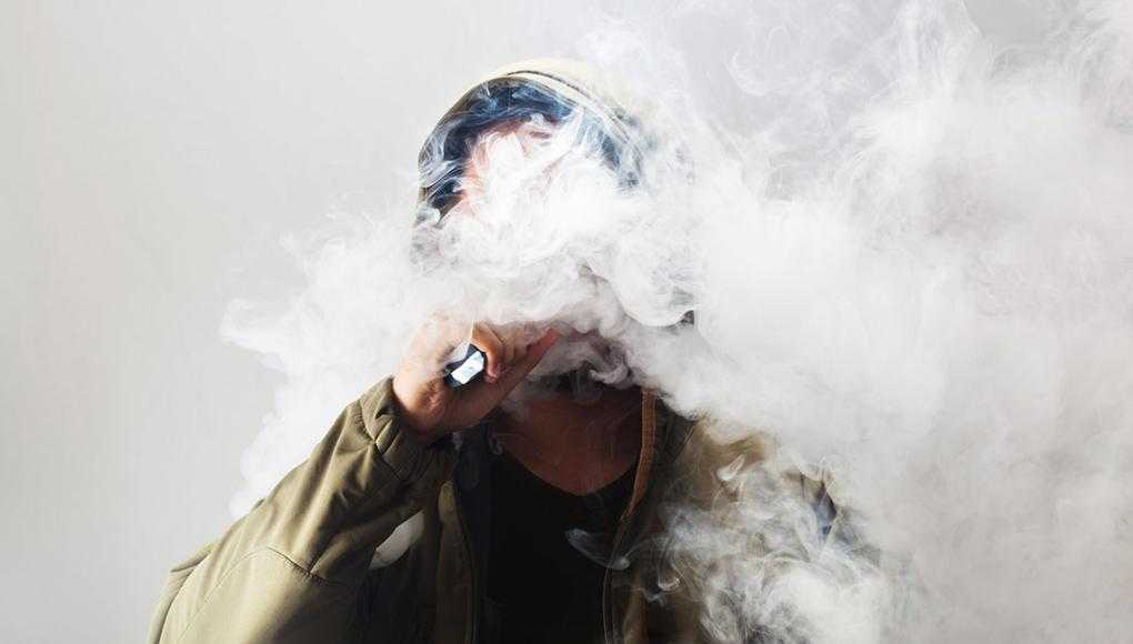 Philly’s Helpful Vape Laws Could Spread to More of PA - A man exhaling a cloud of vapor from his vape