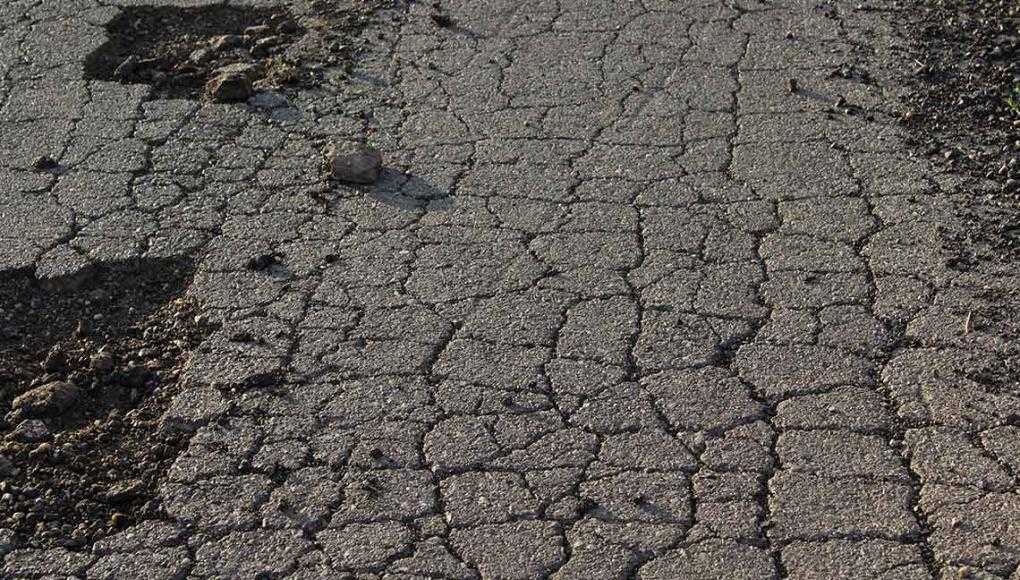 Top 4 Concerns That Prestonsburg Drivers Have When on the Road - An asphalt road with cracks