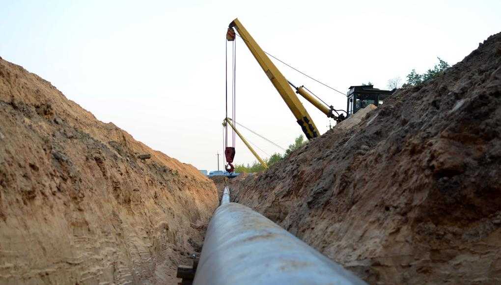 Iron Pipe crane in background