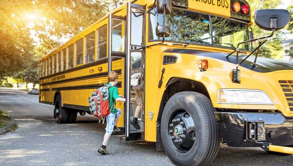 Kids getting on school bus