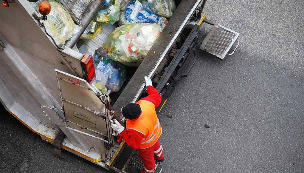 Garbage man on Garbage truck