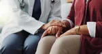 doctor talking to a patient about their cancer diagnosis