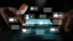 pair of hands scrolling through a phone with various social media icons popping up showing a variety of likes, comments, and other means of communicating via social media and videos.