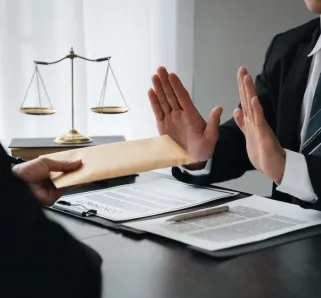 What Happens if You Reject a Settlement Offer - lawyer rejecting settlement offer