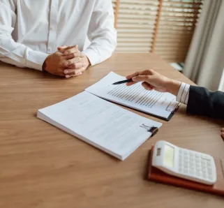 lawyer signing contract with client
