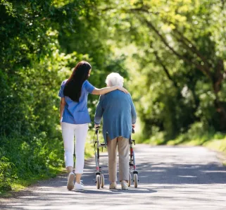 eldery woman with nursing home caretaker