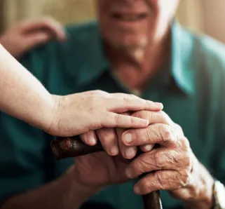 elderly man with a caregiver