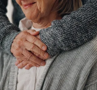 elderly woman with caretaker