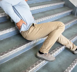 person slipping down stairs