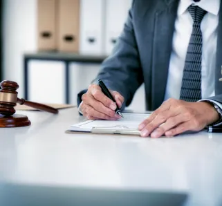 personal injury lawyer signing documents
