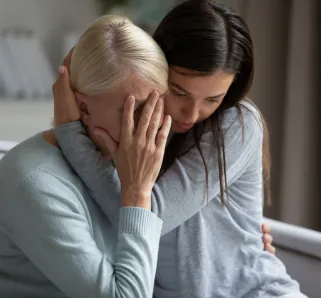 nurse comforting mom after wrongful death
