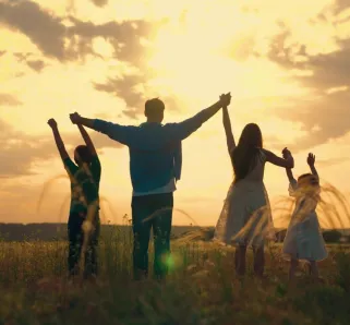family with a sunset in the background