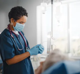 nurse with patient in a hospital room