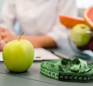 apple, measuring tape and other fruit