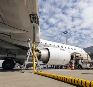 photo of airplaine refueling at airport