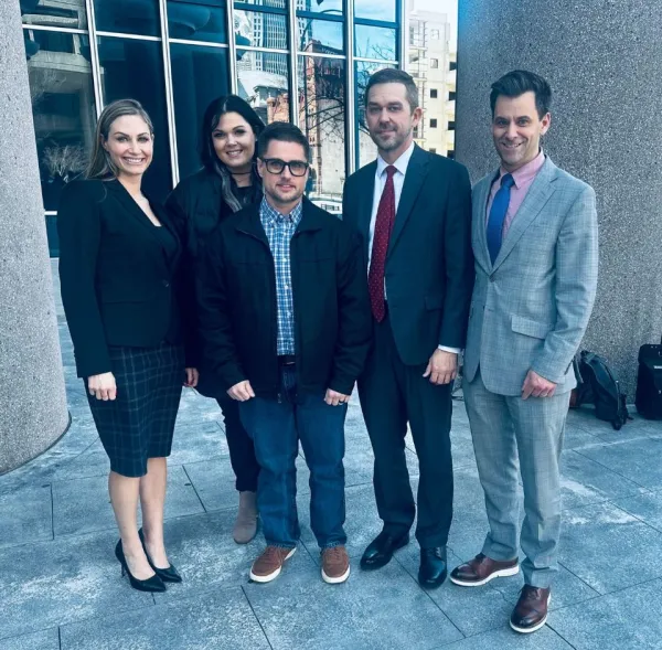 morgan and morgan attorneys with client in louisville County