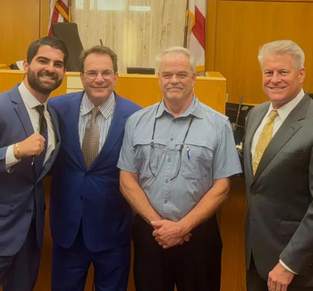 Morgan & Morgan attorneys Patrick Chucri, David Henry and Rick Block with Mr. Brown