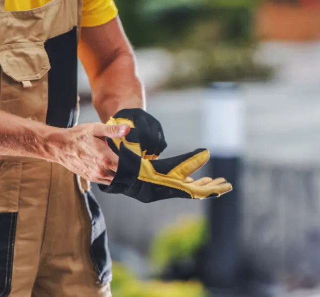 construction worker putting on a glove