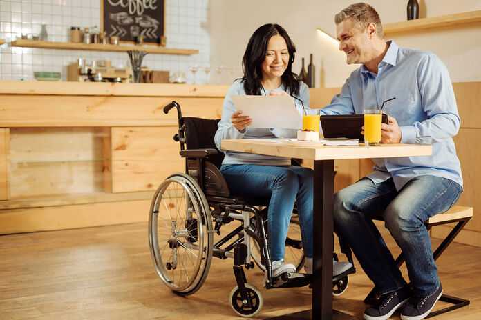 Social Security Attorneys in Detroit, Michigan (MI) - Woman in Wheelchair talking to man