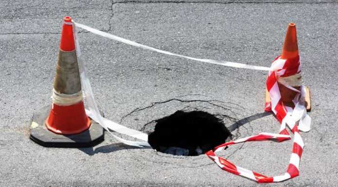 Sinkhole Claims: Hiring an Attorney In Lakeland - sinkhole in the street
