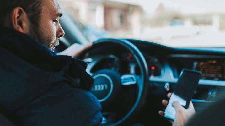 a man texting and driving