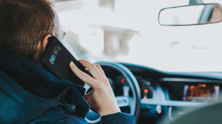 a man using his phone while driving