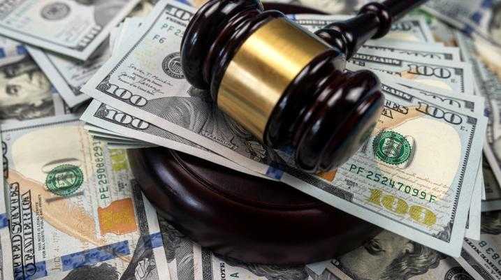 What Damages Can You Sue For - judge hammer with cash