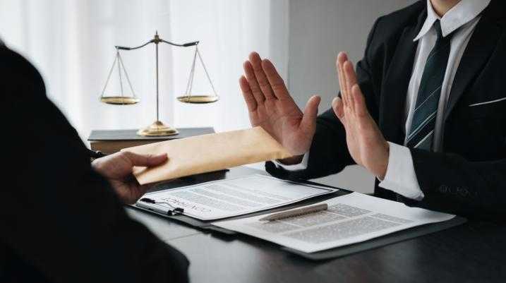 What Happens if You Reject a Settlement Offer - lawyer rejecting settlement offer