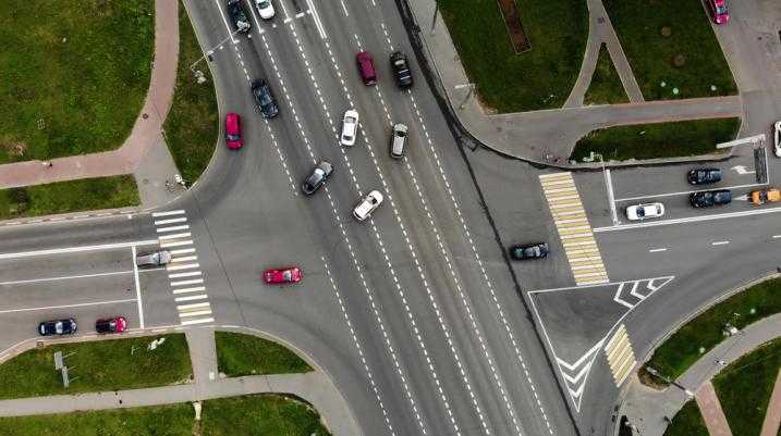 cars in an intersection making left turn