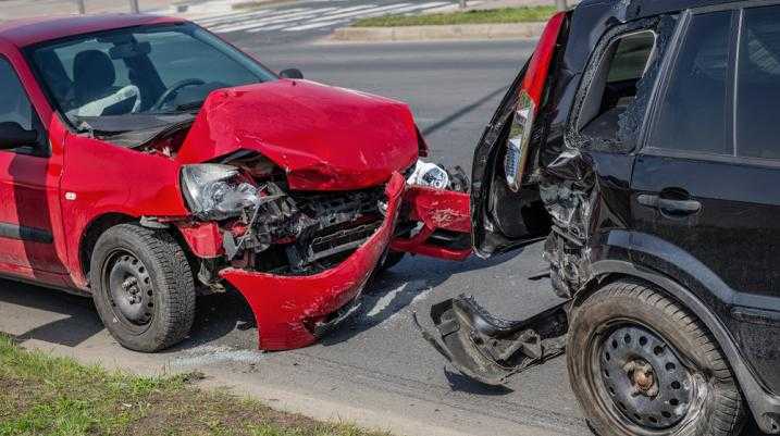 Red car rear ended into a black car