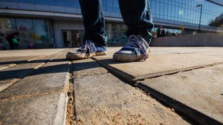 Someone walking on an uneven sidewalk