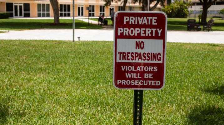 Private property sign on lawn