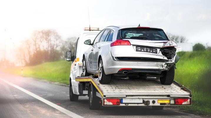 Damaged car being towed