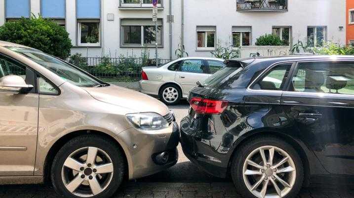 Cars parked very close to each other