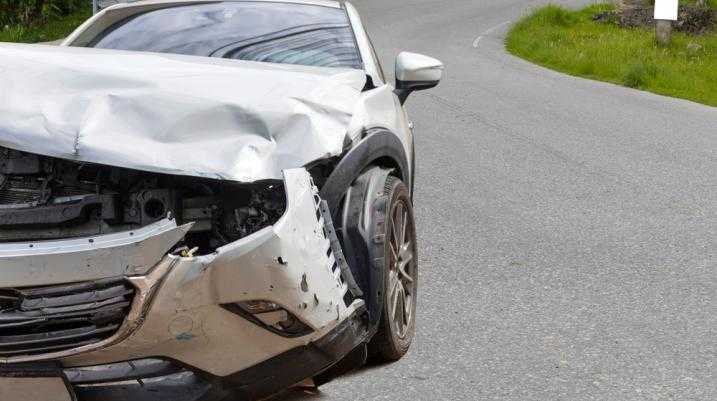 Damaged car on a curved road