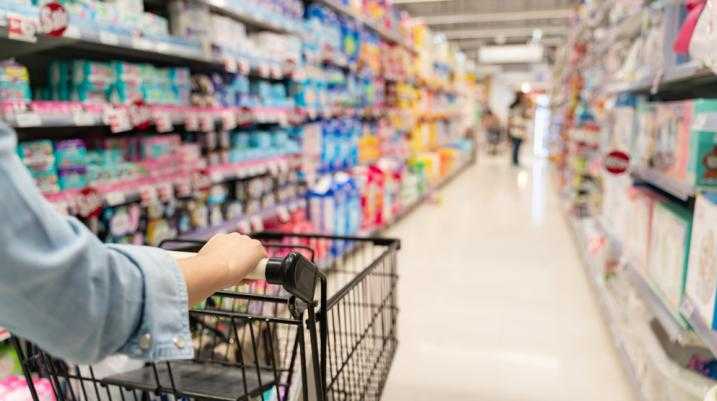 Woman with a shopping cart in a store