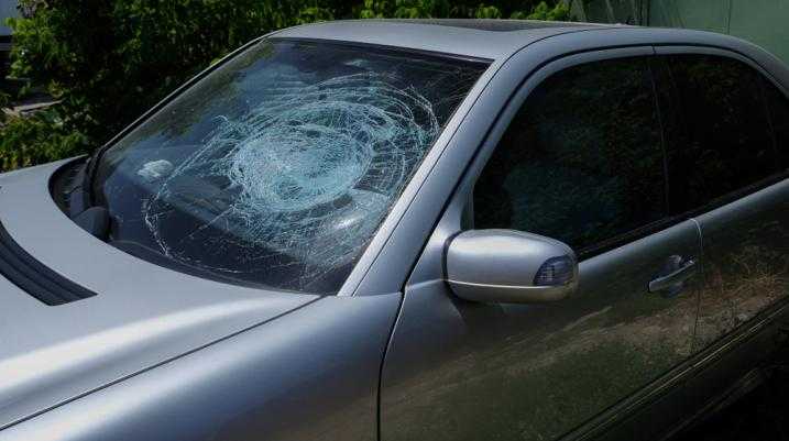 Grey car with a shattered front window