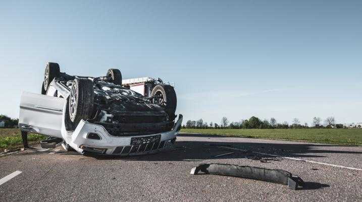 Truck flipped upside down on the road