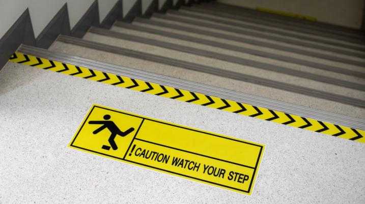 Watch your step sign on stairs