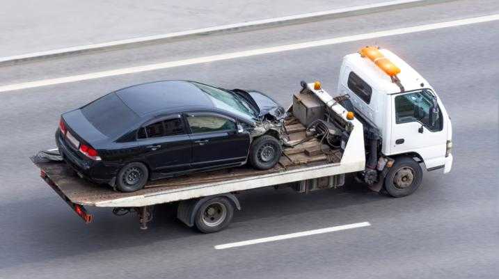 Damaged car being towed